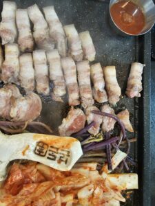 Explore the rich flavors of Jeju with a visit to Bon-Don, a hidden gem in Seogwipo known for its unique water-aged pork delicacies.