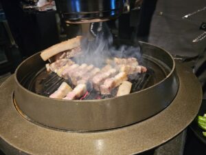 Poongro at Jeju Shinhwa World with Grilled Black Pork Belly