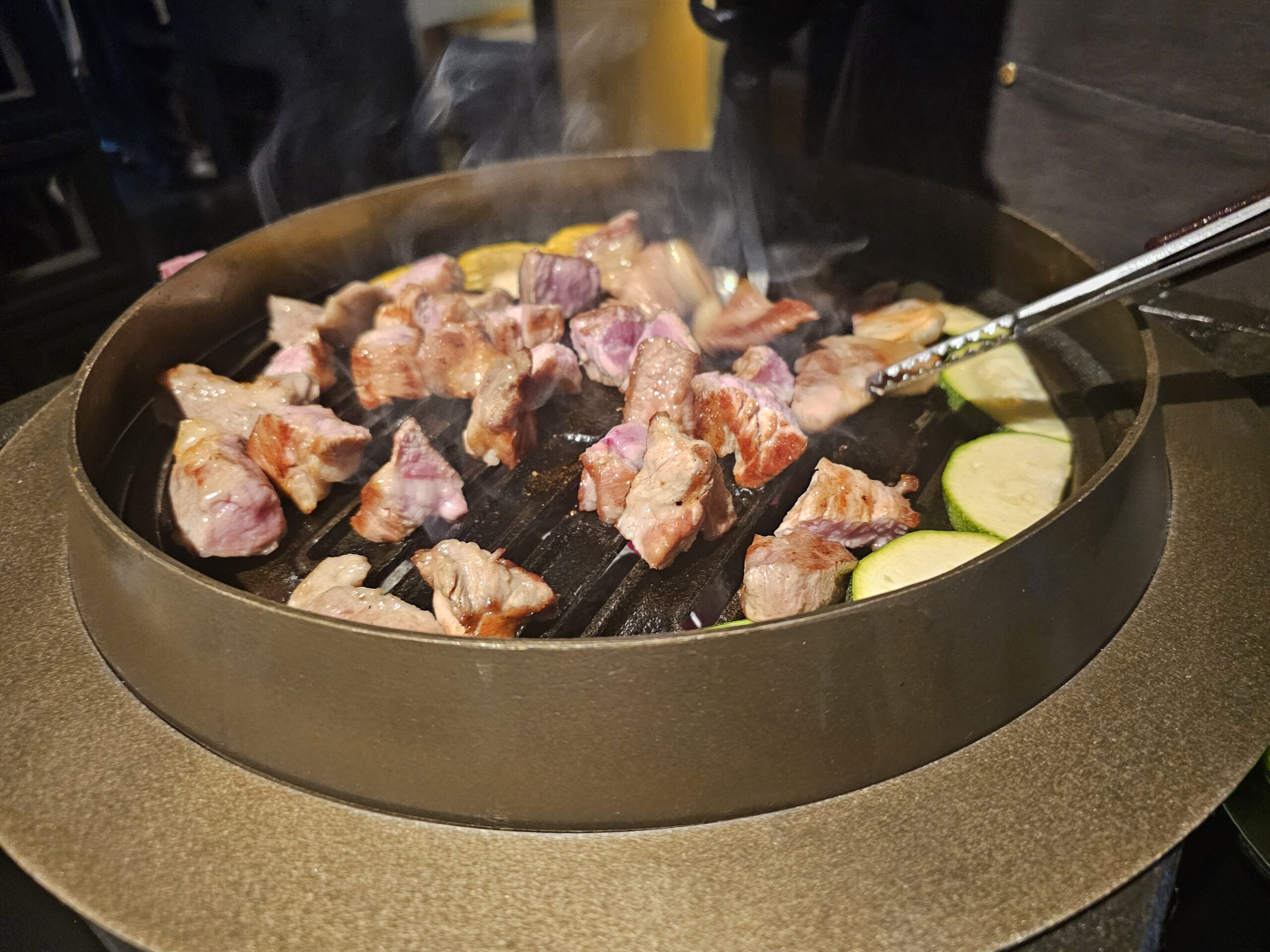 A Culinary Gem in Jeju: Poongro at Jeju Shinhwa World with Grilled Black Pork Belly